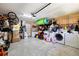 Well-organized garage with storage shelves and washer and dryer at 9831 Edmonton Dr, Land O Lakes, FL 34638