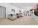 Spacious living room boasts tile floors, recessed lighting, and a modern sectional sofa with stylish pillows at 9831 Edmonton Dr, Land O Lakes, FL 34638
