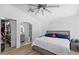 Well-lit main bedroom featuring neutral decor, a walk-in closet, and an ensuite bathroom with modern fixtures at 9831 Edmonton Dr, Land O Lakes, FL 34638