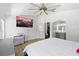 Large, sunny main bedroom featuring neutral decor, and ensuite bathroom, and a walk-in closet for ample storage at 9831 Edmonton Dr, Land O Lakes, FL 34638