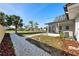 Expansive backyard with lush landscaping, and a private screened in porch at 105 12Th Sw St, Ruskin, FL 33570