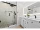 Modern bathroom featuring a glass enclosed shower and double sink vanity at 105 12Th Sw St, Ruskin, FL 33570