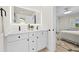 Elegant bathroom with double sink vanity, modern fixtures, and stylish design elements at 105 12Th Sw St, Ruskin, FL 33570