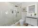 Luxurious bathroom boasts a glass-enclosed shower, modern vanity, and elegant marble accents at 105 12Th Sw St, Ruskin, FL 33570