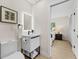 Stylish bathroom featuring modern vanity, sleek fixtures, and convenient access to the bedroom at 105 12Th Sw St, Ruskin, FL 33570