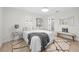 Inviting bedroom with neutral colors, a comfortable bed, and modern decor for a relaxing retreat at 105 12Th Sw St, Ruskin, FL 33570