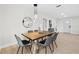 Elegant dining room featuring modern lighting and a stylish table setting, perfect for entertaining guests at 105 12Th Sw St, Ruskin, FL 33570