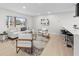 Bright living room with contemporary furnishings, large windows, and a comfortable seating arrangement at 105 12Th Sw St, Ruskin, FL 33570
