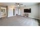 Spacious bonus room featuring neutral carpet, multiple doorways, and a media area at 11828 Ranchers Gap Dr, Odessa, FL 33556