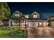 Charming two-story home with well-manicured landscaping, driveway, and three-car garage at 11828 Ranchers Gap Dr, Odessa, FL 33556