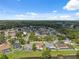 Lovely aerial perspective of a community with well-maintained homes and a serene lake in a desirable location at 12038 Steppingstone Blvd, Tampa, FL 33635