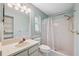 Cozy bathroom features a shower, sink, vanity, and ample lighting for a refreshing experience at 12038 Steppingstone Blvd, Tampa, FL 33635