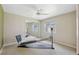 Spare bedroom has neutral carpeting, a mirrored closet, and abundant sunlight from the windows at 12038 Steppingstone Blvd, Tampa, FL 33635