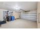 Spacious garage with epoxy flooring, built-in cabinets, and overhead storage at 12038 Steppingstone Blvd, Tampa, FL 33635