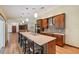 Spacious kitchen features a large center island, stainless steel appliances, and warm wood cabinetry at 12038 Steppingstone Blvd, Tampa, FL 33635