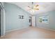 Spacious main bedroom with an abundance of natural light, neutral paint, and access to additional rooms at 12038 Steppingstone Blvd, Tampa, FL 33635