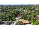 Aerial view of a property among a canopy of trees, situated close to the city skyline at 1217 E 29Th Ave, Tampa, FL 33605