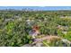 Aerial view of property with mature trees and view of Tampa skyline at 1217 E 29Th Ave, Tampa, FL 33605