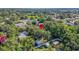 Aerial view showing the property's location within a neighborhood with mature trees and surrounding green spaces at 1217 E 29Th Ave, Tampa, FL 33605