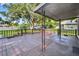 Open and spacious back deck with mature trees in the backyard, perfect for outdoor gatherings at 1217 E 29Th Ave, Tampa, FL 33605