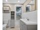 Updated bathroom with tiled walls and cabinet storage at 1217 E 29Th Ave, Tampa, FL 33605