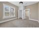 Carpeted bedroom with natural light from large windows at 1217 E 29Th Ave, Tampa, FL 33605