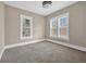 Bedroom featuring carpeted floors, windows, and neutral colors at 1217 E 29Th Ave, Tampa, FL 33605