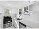 Beautiful renovated kitchen featuring stainless steel appliances and bright white subway tile backsplash at 1217 E 29Th Ave, Tampa, FL 33605