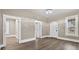 Open living room features laminate floors, arched entryways, with many windows offering plenty of natural light at 1217 E 29Th Ave, Tampa, FL 33605