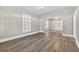 Open living room features laminate floors and arched entryways, offering a seamless flow throughout the home at 1217 E 29Th Ave, Tampa, FL 33605