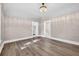 Bright living room with laminate flooring, showing doorways to other rooms and archways at 1217 E 29Th Ave, Tampa, FL 33605