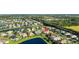 Stunning aerial view of the property in a beautiful community with a serene lake at 12830 24Th Street E Cir, Parrish, FL 34219