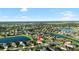 Community aerial view showcases the lakefront property surrounded by lush landscaping at 12830 24Th Street E Cir, Parrish, FL 34219