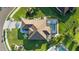 Overhead view showcases the home's expansive roof, private pool area, and landscaped yard at 12830 24Th Street E Cir, Parrish, FL 34219