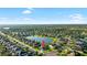 Community aerial view showing property location amongst lush greenery, lakes, and serene surroundings at 12830 24Th Street E Cir, Parrish, FL 34219