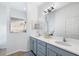 Bathroom featuring a large vanity with double sinks, modern lighting, and walk-in shower at 12830 24Th Street E Cir, Parrish, FL 34219