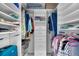 Spacious walk-in closet with built-in shelves, drawers, and plenty of hanging storage at 12830 24Th Street E Cir, Parrish, FL 34219