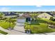 Charming home with well-manicured lawn, beautiful landscaping, and a welcoming driveway at 12830 24Th Street E Cir, Parrish, FL 34219
