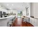 Bright kitchen featuring white cabinets, stainless appliances, and an island with bar stool seating at 12830 24Th Street E Cir, Parrish, FL 34219