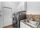 Efficient laundry room with modern appliances and ample storage at 12830 24Th Street E Cir, Parrish, FL 34219