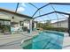 Relaxing screened-in pool area with outdoor seating and clear blue water at 12830 24Th Street E Cir, Parrish, FL 34219