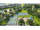 Aerial view of community park and recreation area featuring tennis courts and basketball court at 12830 24Th Street E Cir, Parrish, FL 34219