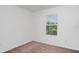 Bright bedroom features neutral carpeting and a window providing natural light at 12841 Buffalo Run Dr, Gibsonton, FL 33534