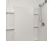 Shower showcasing a detachable shower head and clean white tile at 12841 Buffalo Run Dr, Gibsonton, FL 33534