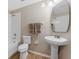 Bathroom with a tub-shower combination and a pedestal sink at 13003 Carlington Ln, Riverview, FL 33579