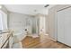 Bathroom featuring a shower, bathtub, and wood-look floors at 13003 Carlington Ln, Riverview, FL 33579