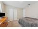 Bedroom with plush carpet and comfortable bedding at 13003 Carlington Ln, Riverview, FL 33579