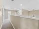 Spacious second-floor hallway offering access to the bedrooms, a bathroom, and a view of the outdoors at 13003 Carlington Ln, Riverview, FL 33579