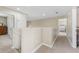 Second floor hallway features carpet and views into the bedrooms at 13003 Carlington Ln, Riverview, FL 33579