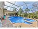 Large screened pool and spa area with ample seating, offering the perfect outdoor oasis at 13003 Carlington Ln, Riverview, FL 33579